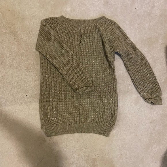 I am selling A size Xs gold-coloured sweater with a girl's print on the front. - Picture 2 of 3